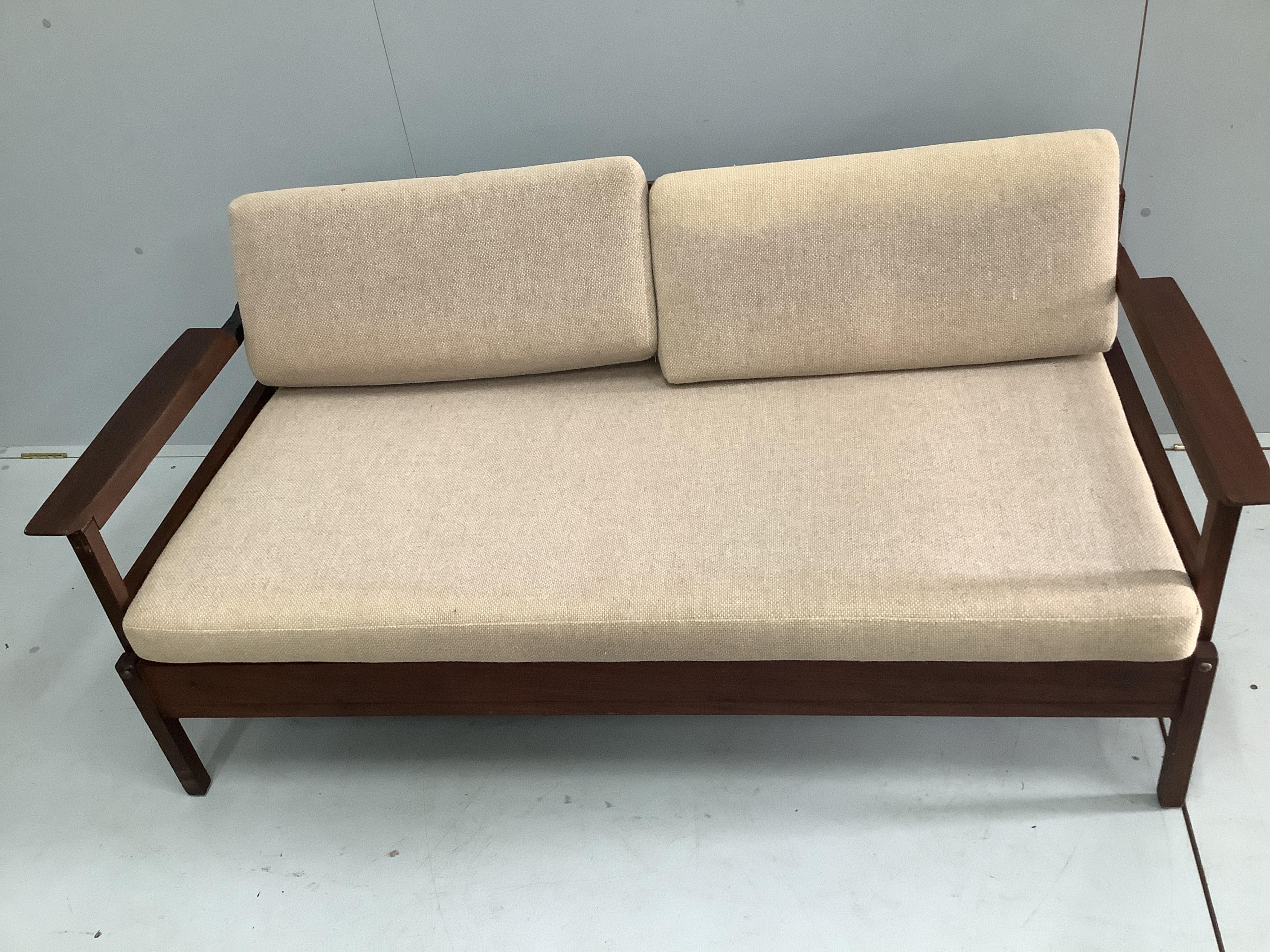 A mid century Robin Day style teak sofa bed, width 149cm, depth 72cm, height 68cm. Condition - poor